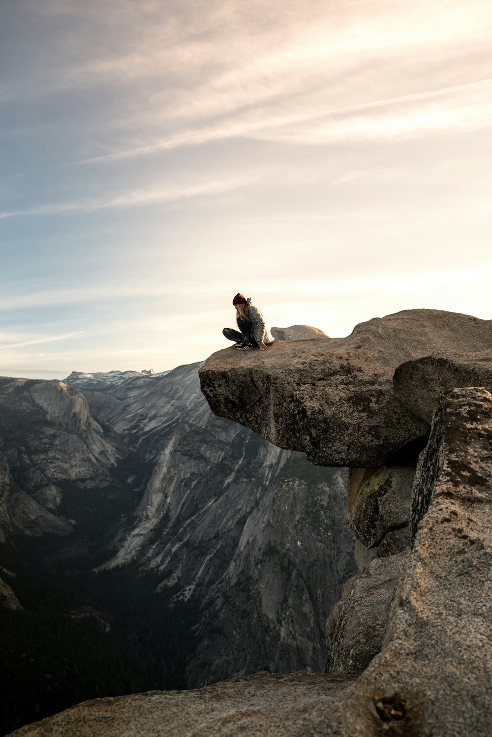 person sitting on brown mountain