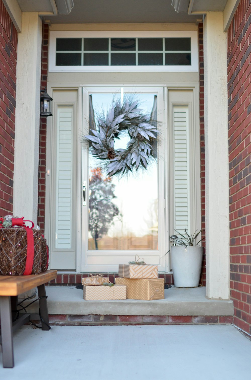 wreath hanging on full-lite door of house