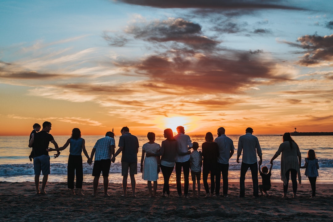 family at beach at sunset