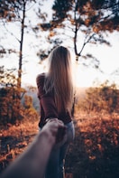 woman holding someone's hand