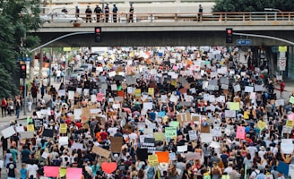 a large group of people holding up signs