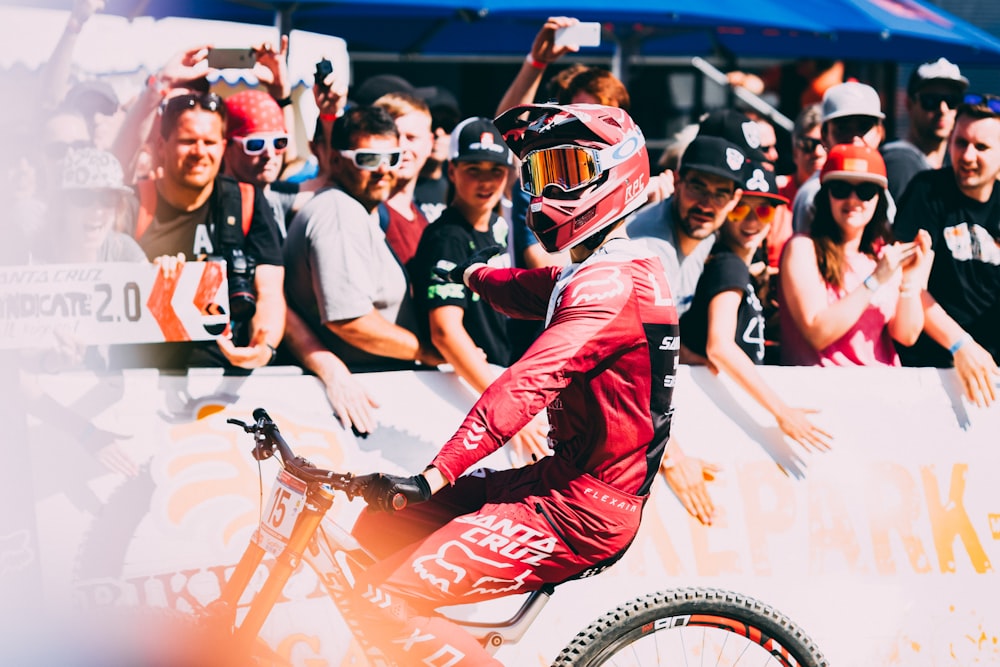 man wearing red motocross helmet during daytime