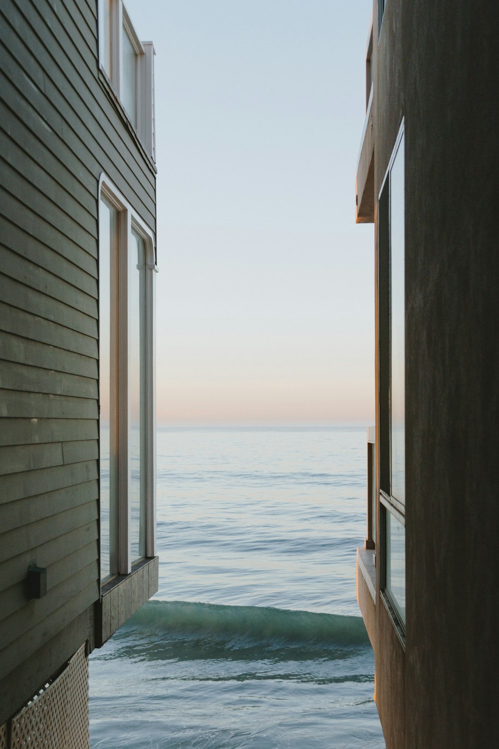 house in front of body of water