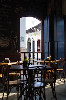Exterior view of the coffee shop nestled within the church, bathed in golden afternoon light.