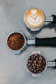 flat lay photography of coffee latte, ground coffee, and coffee beans