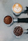 flat lay photography of coffee latte, ground coffee, and coffee beans