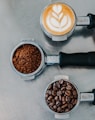 flat lay photography of coffee latte, ground coffee, and coffee beans