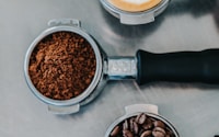 flat lay photography of coffee latte, ground coffee, and coffee beans