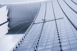 low-angle photography of glass window building during daytime
