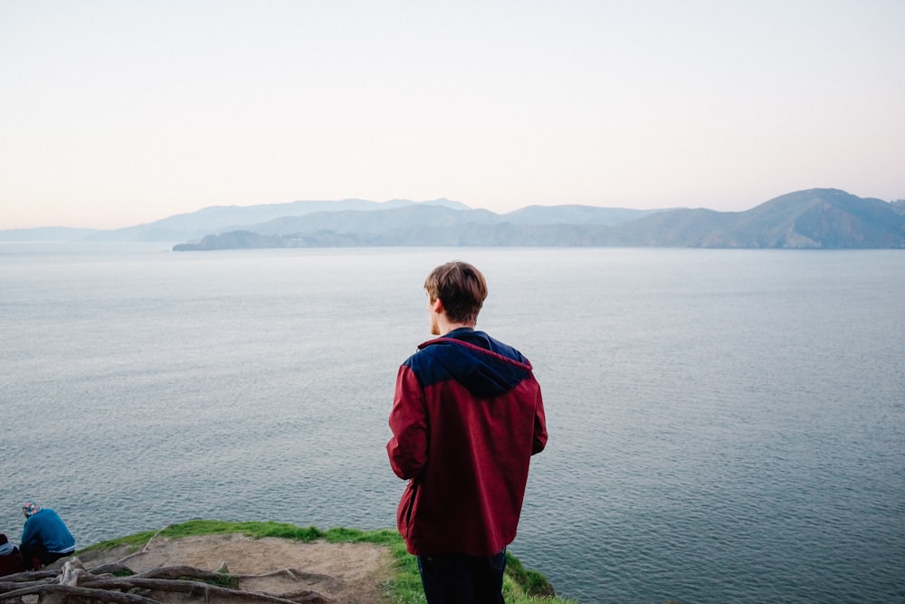 man standing on cliff