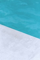 Close-up of a pristine pool surface being vacuumed by a professional from Pristine Pools, LLC.