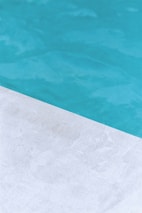 Before and after images of a pool remodel showcasing remarkable transformation.