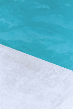 Close-up of a smooth fiberglass pool edge with detailed craftsmanship, highlighting the quality finish.