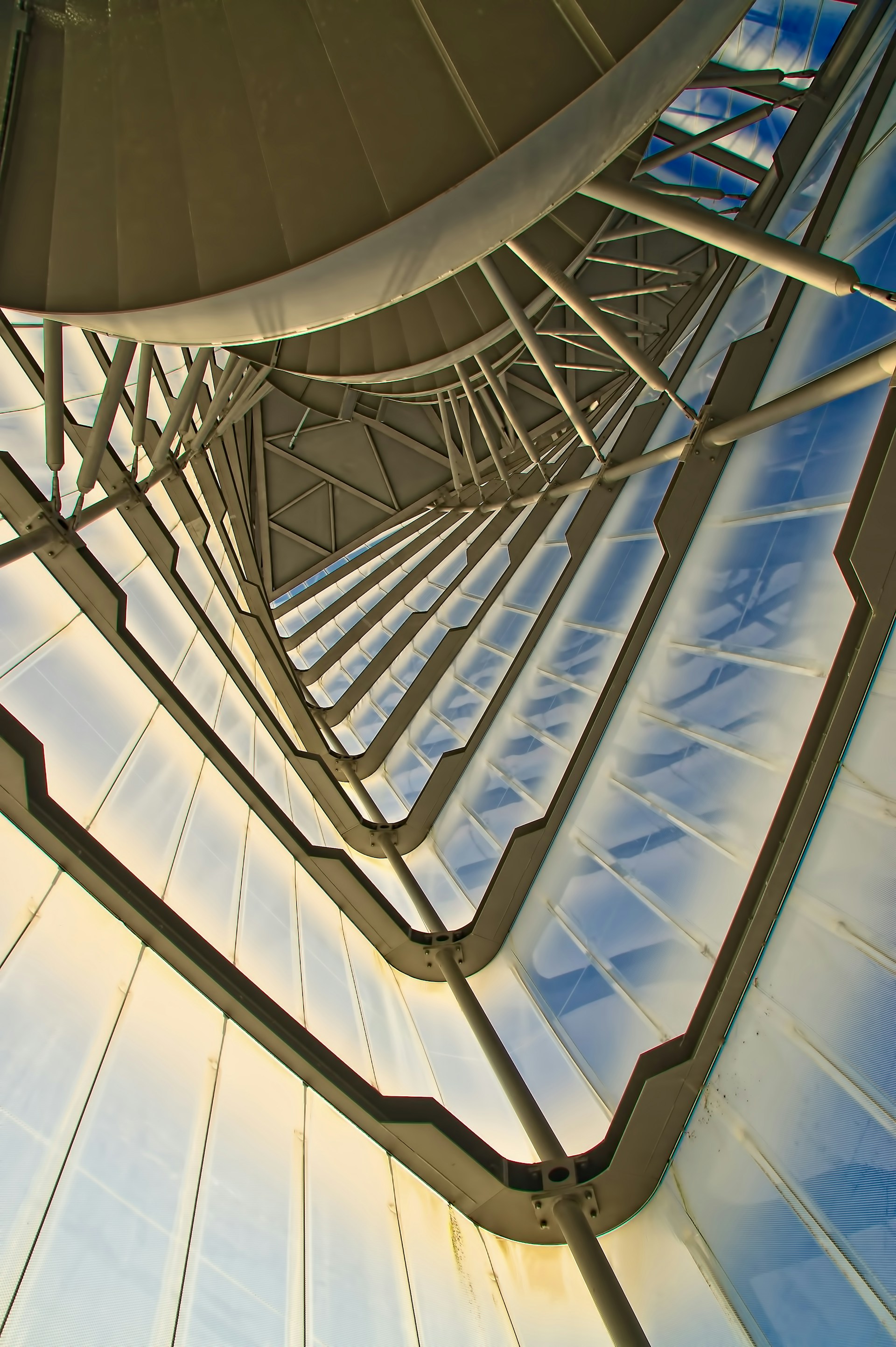 a very tall metal structure with lots of windows