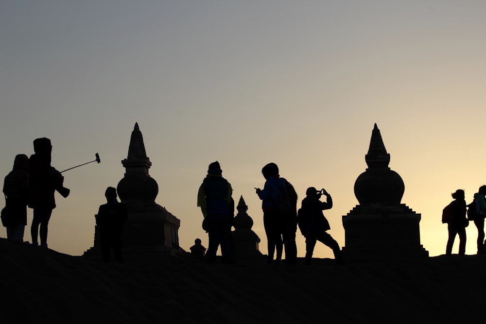 a group of people standing on top of a roof