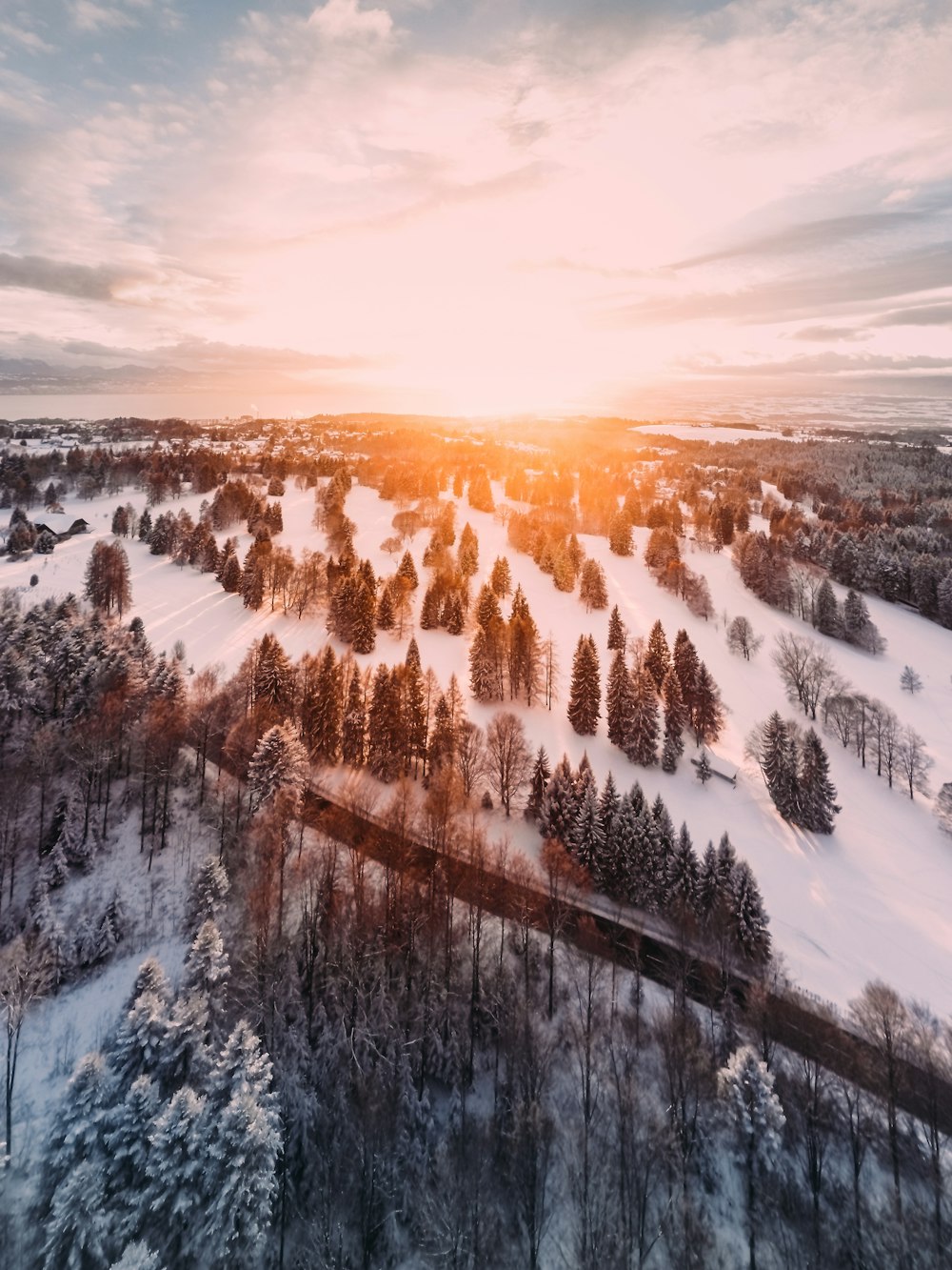 snow covered mountain during sunset