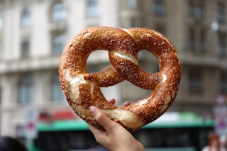 person holding pretzel