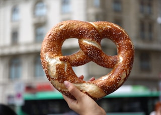 person holding pretzel