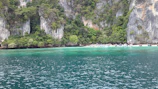 Scenic view of Komodo Island from the boat with lush green hills