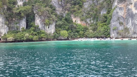 Beautiful scenic view of Lombok island with tourists enjoying a boat trip.