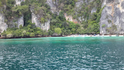 Scenic view of Komodo Island from the boat with lush green hills