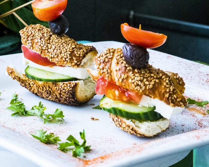 #1076 bread, sliced cucumber, and tomatoes on plate