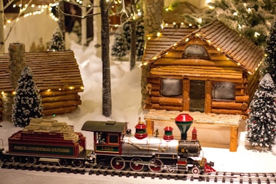 multicolored train toy near house