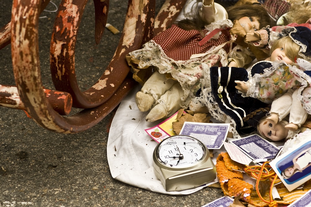 dolls beside wagon wheel, Street market detail