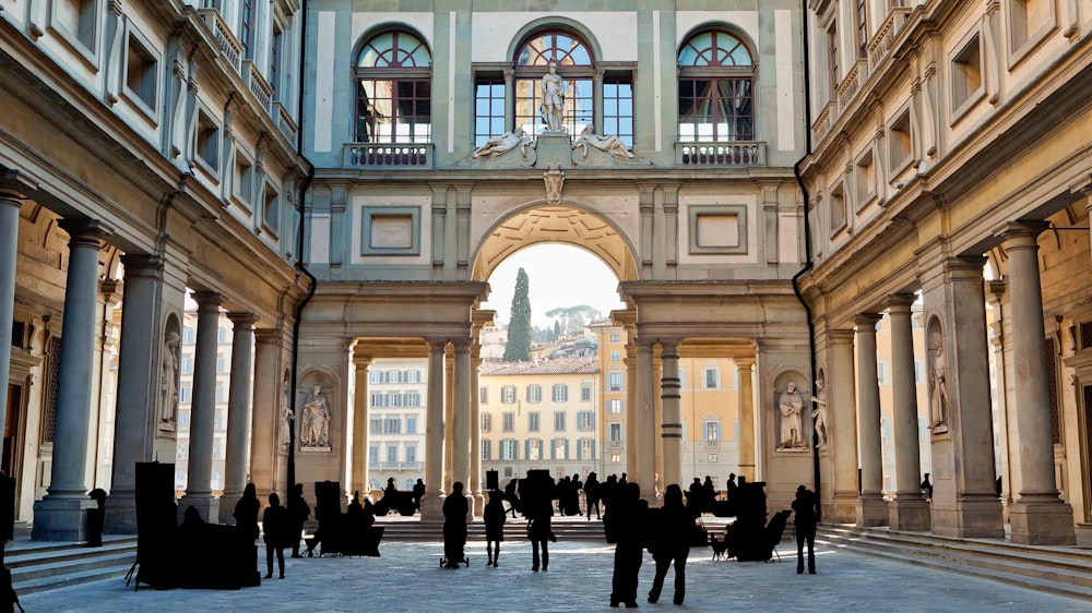 silhouette photo of people standing inside building