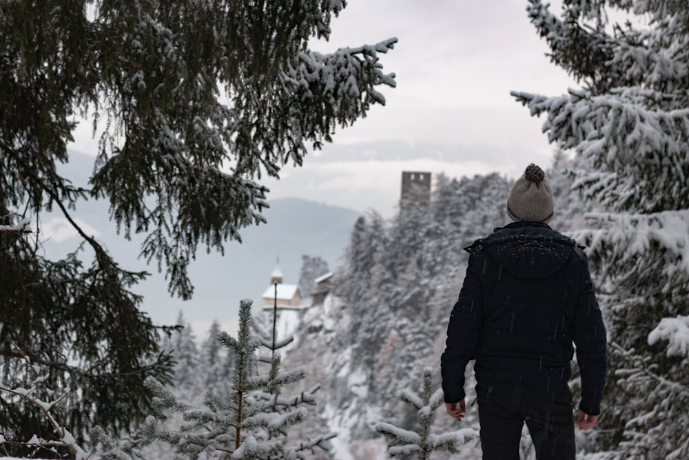 man standing near trees