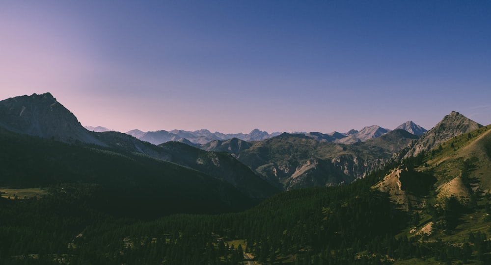 mountain range under blue skies