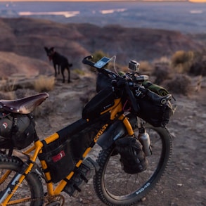 yellow bicycle on mountain