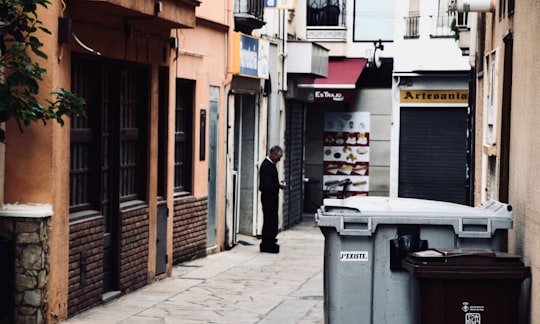 person standing near closed door in hallway in Lloret de Mar Spain