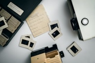 An old projector casting slides of harmonic oscillation and resonance diagrams during a lecture.