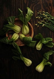 spinaches on brown wooden plate