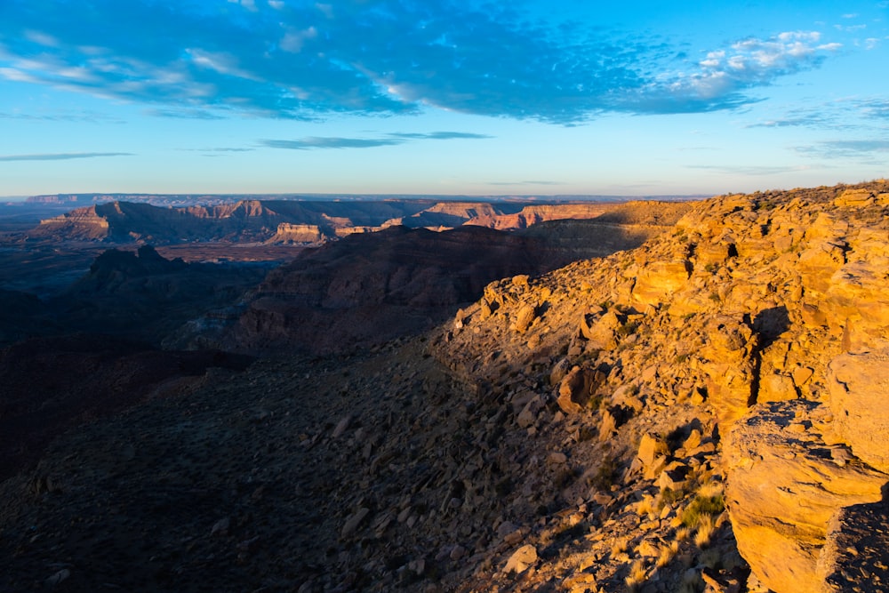 brown and green mountains under blue sky during daytime