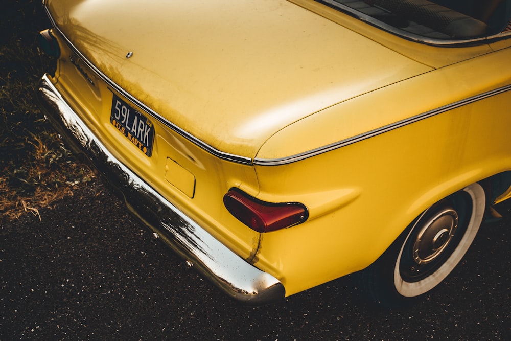 close up photography of yellow vehicle