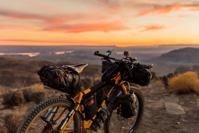 Minimalist bikepacking setup with lightweight bags on a mountain bike in alpine terrain