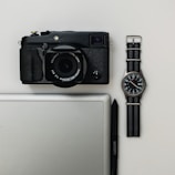 Flat lay of lifestyle items including gadgets and sports gear.