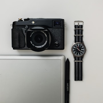 Flat lay of lifestyle items including gadgets and sports gear.