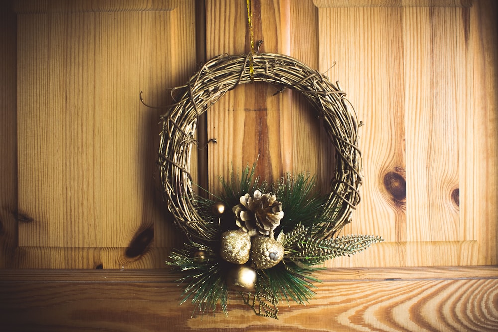 brown twig wreath on brown wooden wall