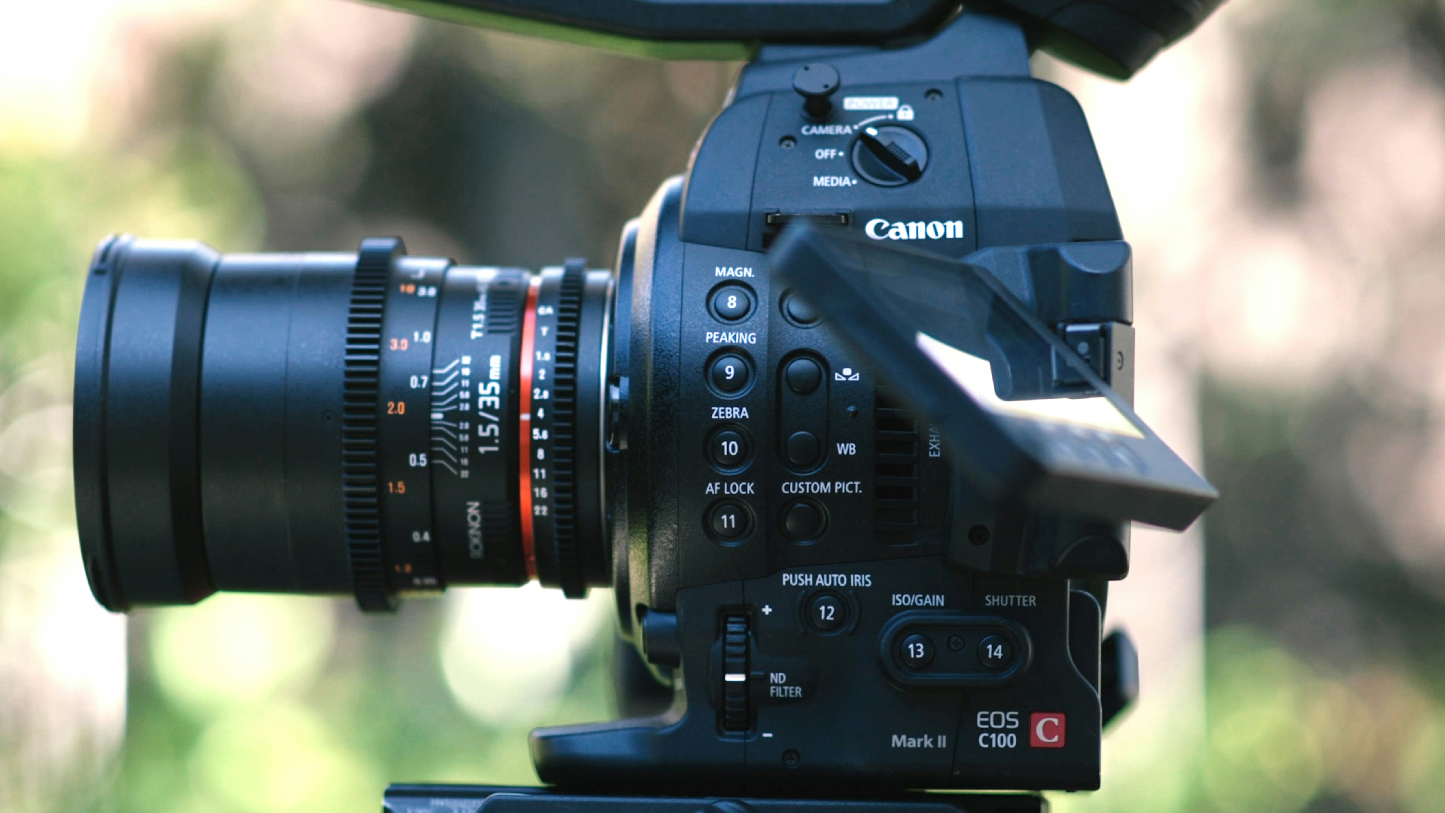 depth of field photography of black Canon DSLR camera