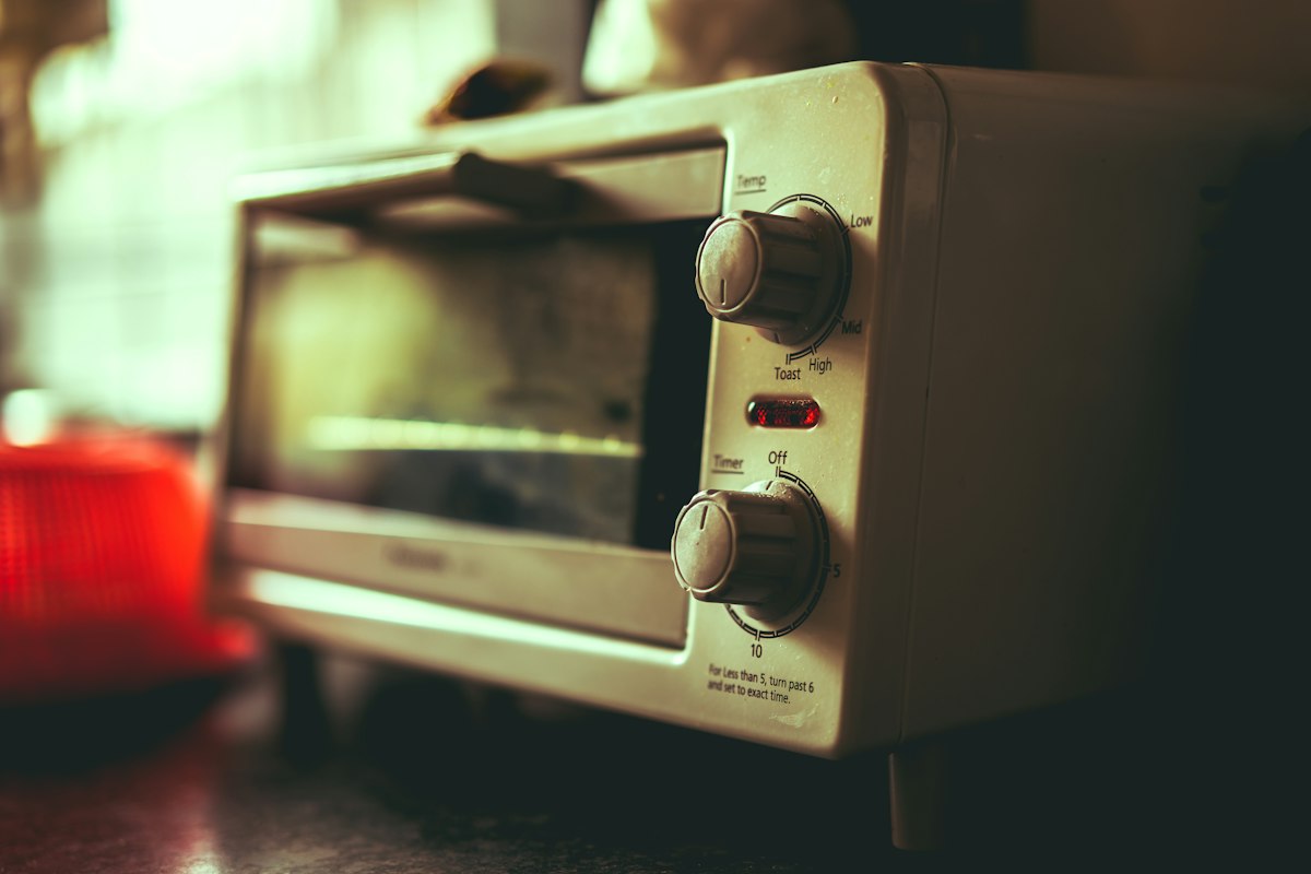 White compact toaster oven in a kitchen