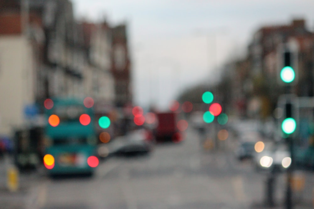 blue vehicle in bokeh photography