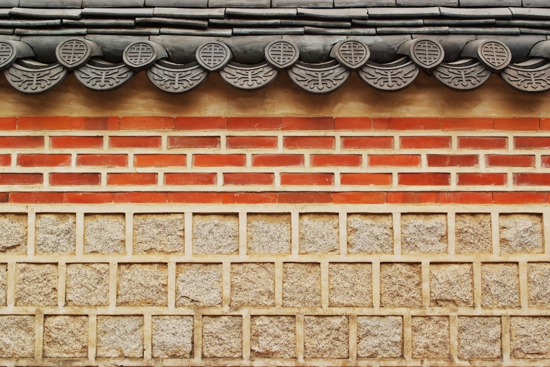 minimalist photography of concrete building wall, A Korean-style stone wall