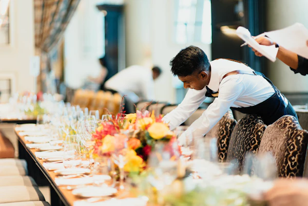 hotel waiter assisting guest
