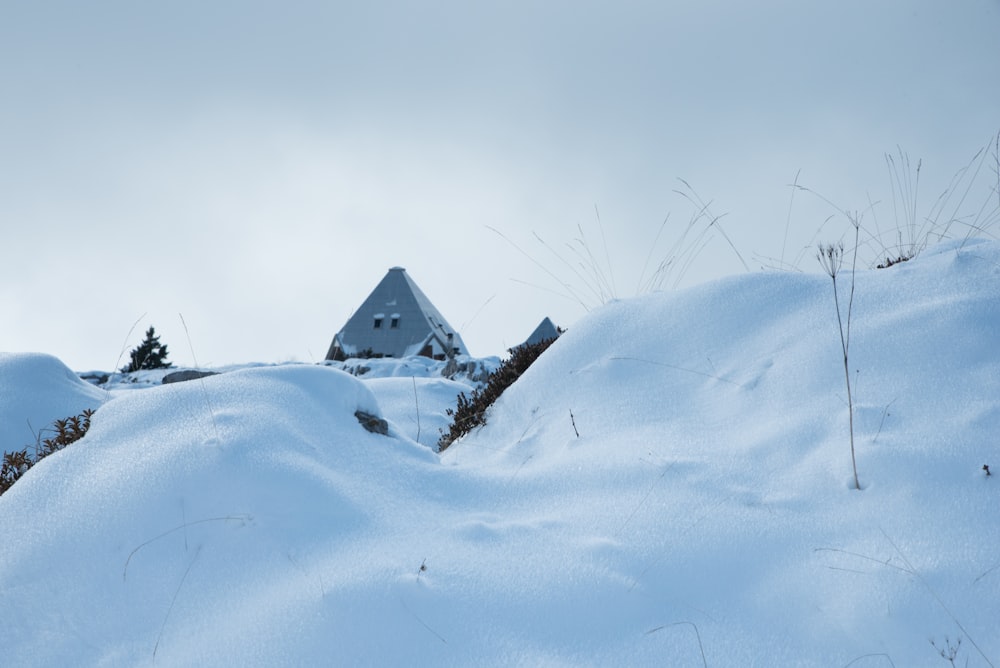 photo of structure on hill during winter