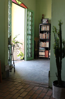 A cozy, sunlit office space with books and plants, reflecting a warm research environment.