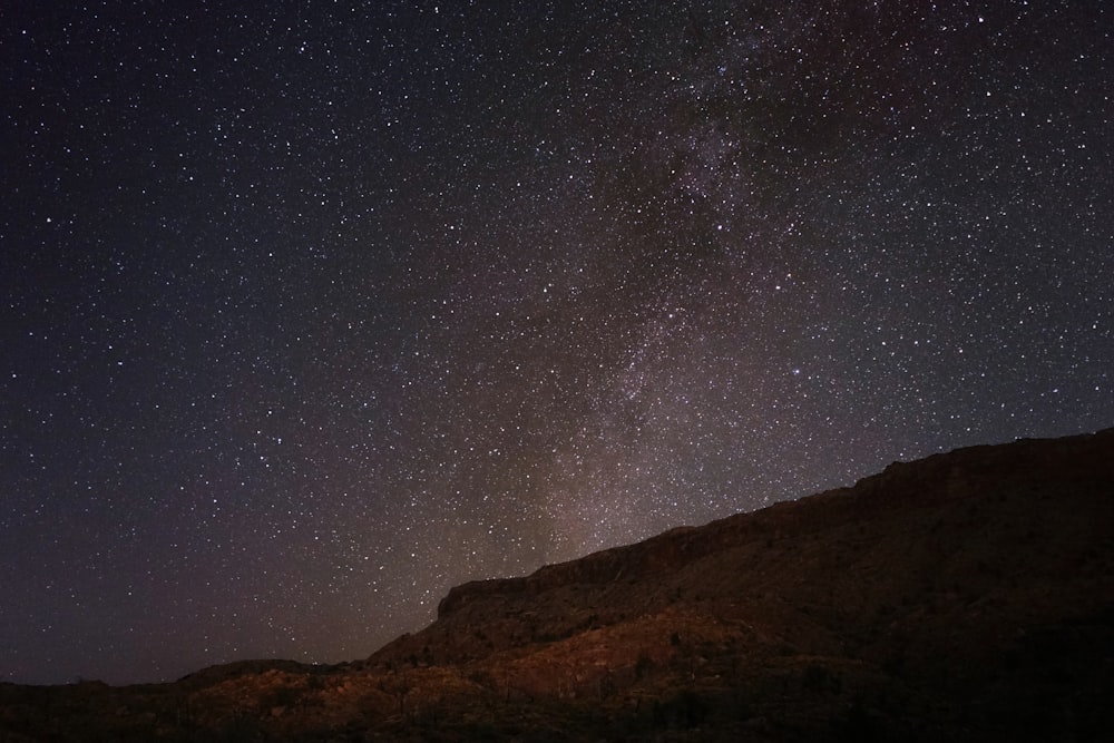 mountain under starry sky