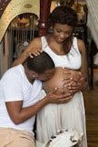 man kissing woman's stomach
